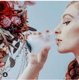 Bello Glass filled with vapor woman sips